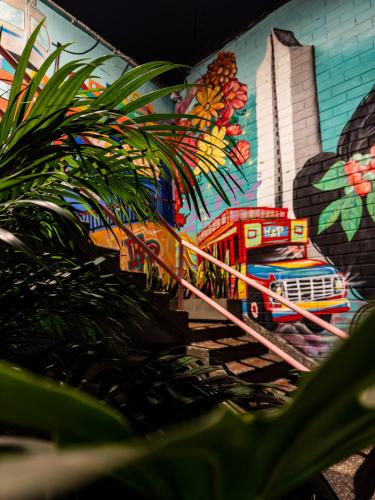 a mural of a fire truck on the side of a wall at Hostel43 in Estación El Salto