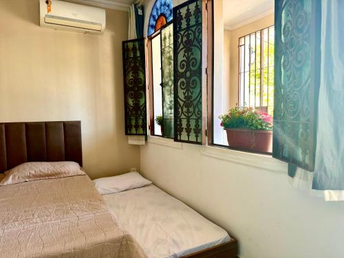 Una cama o camas en una habitación de Casa da Josi - Pajuçara