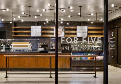 a coffee shop with a sign that reads for five coffee nurses at Loews Chicago Hotel in Chicago