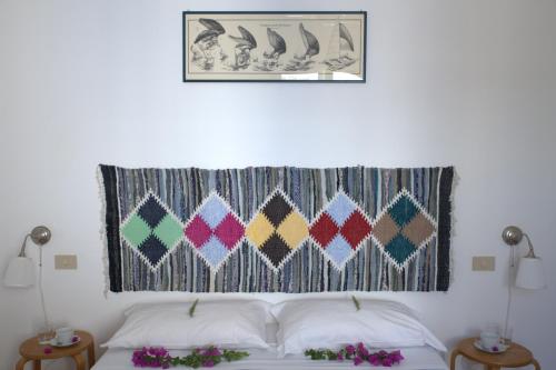 Postel nebo postele na pokoji v ubytování Marettimo Residence