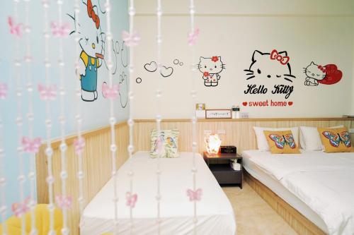 Cama o camas de una habitación en 夏之戀民宿 可包棟 近金城市區