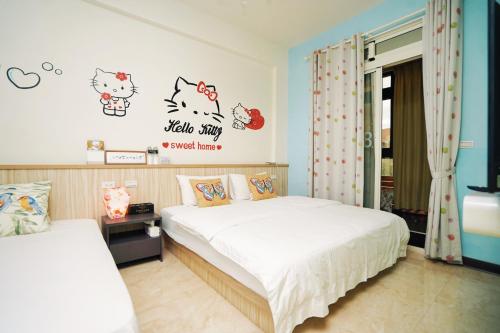 Cama o camas de una habitación en 夏之戀民宿 可包棟 近金城市區