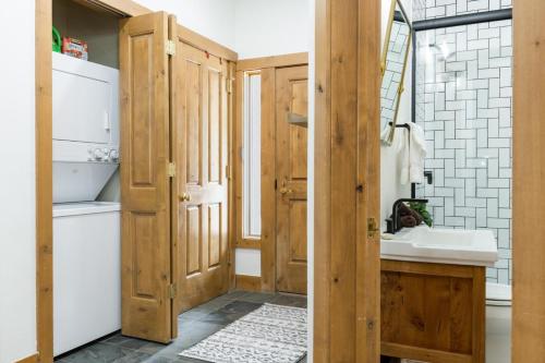 a bathroom with wooden doors and a sink at 118 Villa Montane in Avon
