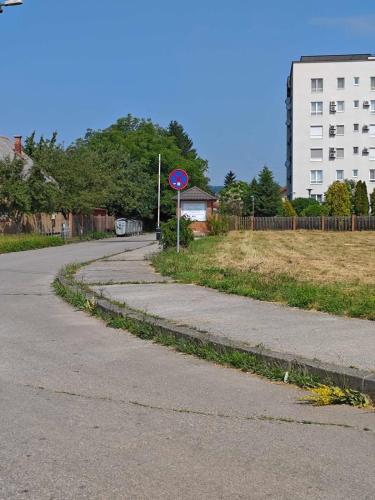 an empty street with a stop sign on the side of the road at Peaceful Family Stay Ilidza with Free Parking in Sarajevo