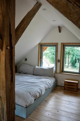 Llit o llits en una habitació de Tiny house Le Séchoir