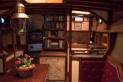 a kitchen with a table with a bowl of fruit on it at Nereid in Nisída Ágios Nikólaos