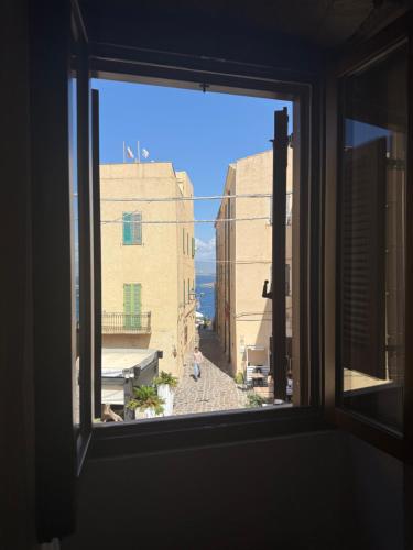 a view from a window of a street with buildings at Il mio tempo al Castello in Castelsardo