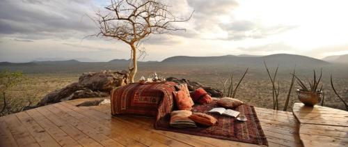 a blanket with a tree on top of a table at Saruni Samburu in Archers Post