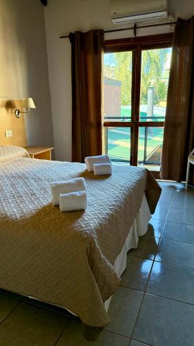 Ένα ή περισσότερα κρεβάτια σε δωμάτιο στο Azul Hotel & Spa