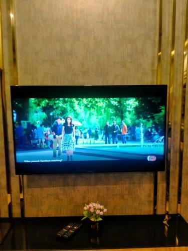 Télévision ou salle de divertissement dans l'établissement Imperial Suites