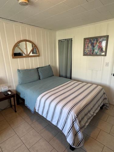 a bed sitting in a room with at North Beach Motel in Hampton