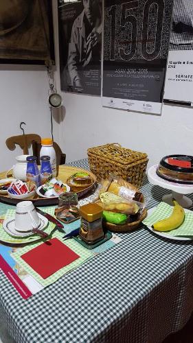a table with plates of food on top at La Torretta - Cerreto Grue in Sarezzano