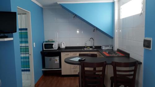 Kuchyň nebo kuchyňský kout v ubytování Apart Hotel Colors