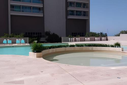 Πισίνα στο ή κοντά στο Estilo y comodidad a pasos de la playa en Irotama!