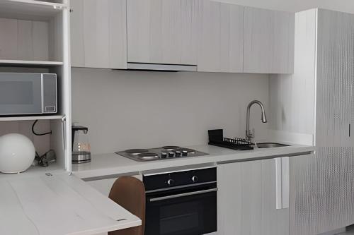 Η κουζίνα ή μικρή κουζίνα στο Estilo y comodidad a pasos de la playa en Irotama!