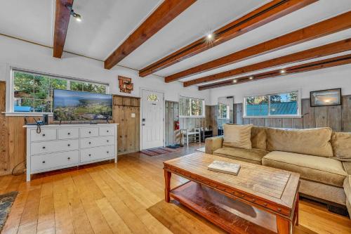 a living room with a couch and a coffee table at Tahoe City Gem Pet Friendly Yard Walk to Beach in Tahoe City