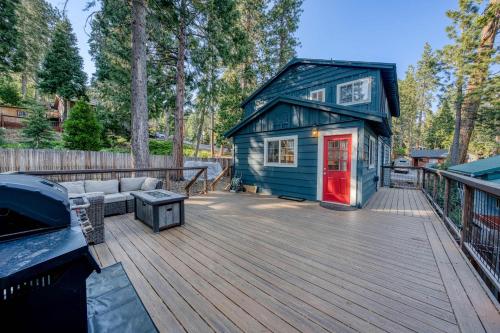 a blue tiny house on a wooden deck at Tahoe City Gem Pet Friendly Yard Walk to Beach in Tahoe City