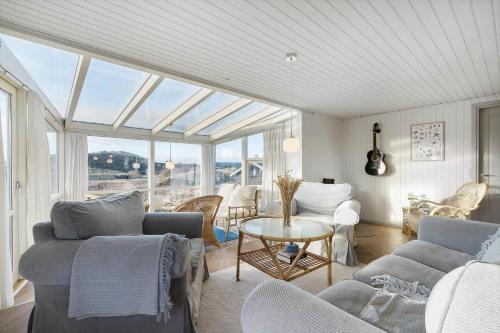 a living room with couches and a table at 172-Ringkobing-Magedalen-34 in Ringkøbing