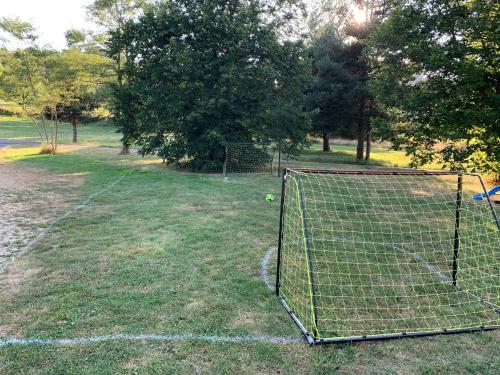 a soccer goal with a ball in a field at Domaine Au Vert Gna ! in Saint-Hostien