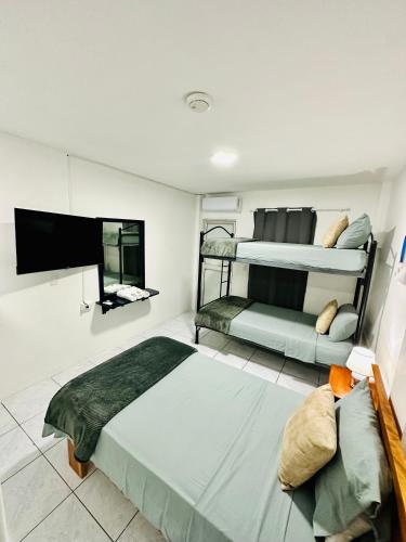 Postel nebo postele na pokoji v ubytování Hostal Elizabeth