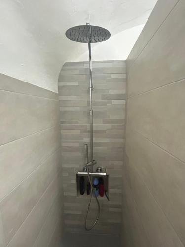 a shower in a bathroom with a shower head at Casa del Gelsomino in Cuglieri