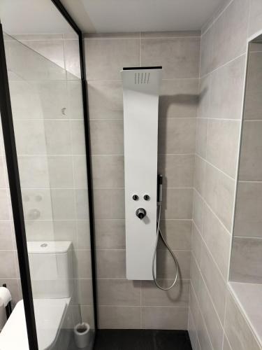 a shower with a face drawn on the wall at Indivision Bernard Pillaud in Chantonnay