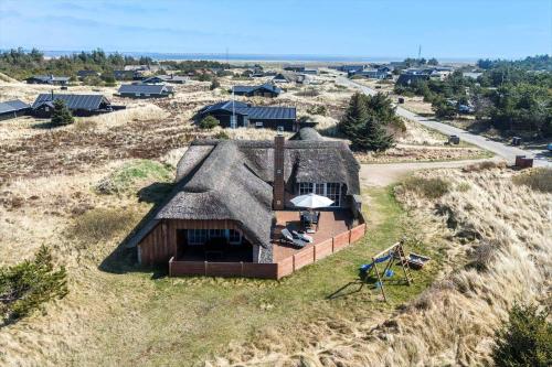 an aerial view of a house in a field at 2227-Ringkobing-Fladsbjergvej-116 in Klegod