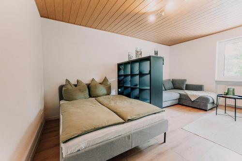 En eller flere senge i et værelse på Ferienwohnung - Zur Waldruhe