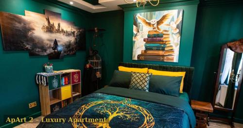 a bedroom with green walls and a bed with a blue bedspread at ApArt Gallery Apartment 2, Stylish 3- Bed , Free Parking ,Sleeps 6 in Bedford