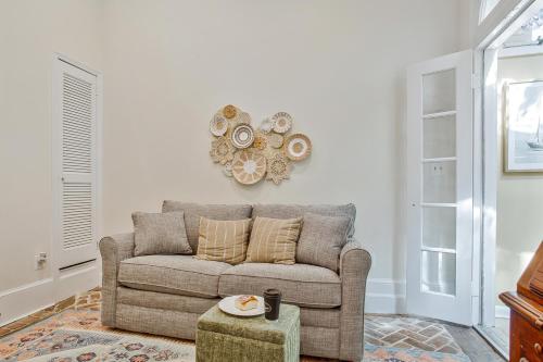 a living room with a couch and a table at Historic Row Home in Downtown Annapolis in Annapolis