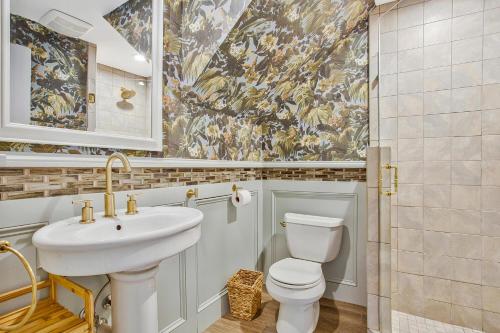 a bathroom with a sink and a toilet at Historic Row Home in Downtown Annapolis in Annapolis
