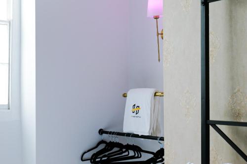 a kitchen with a towel hanging on a wall at Hyacinth Apartments - Hot Tub Garden Escape - Adults only in Brighton & Hove