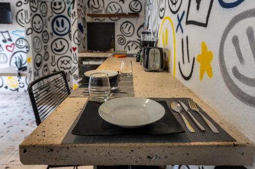 a table with a plate on top of it at Art Studios in Cancún
