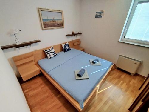 a small room with a bed and a couch at Marina View Apartment Izola in Izola