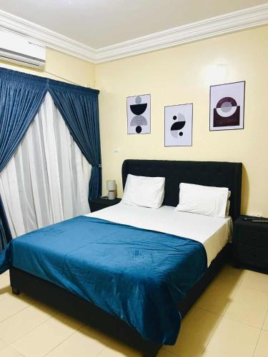 Llit o llits en una habitació de Doumassou Appartement