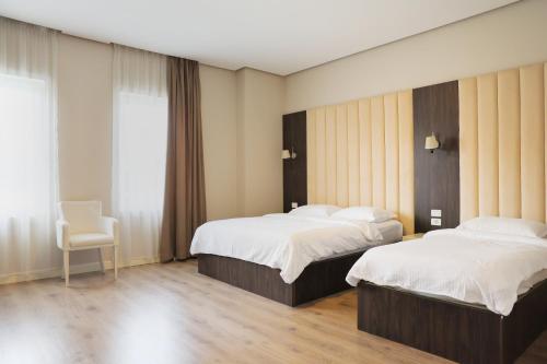 Postel nebo postele na pokoji v ubytování Gardenland Resort