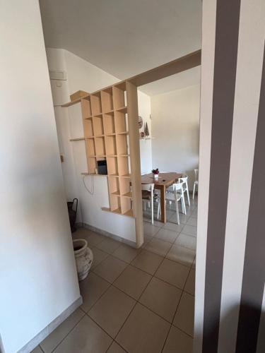 a kitchen and dining room with a table and chairs at Il Desiderio in Angri