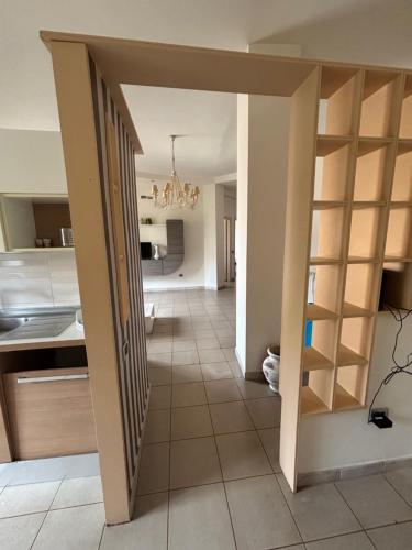 a view of a kitchen and a hallway with a open door at Il Desiderio in Angri