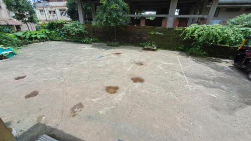 an empty parking lot in front of a building at Sangita Lodge in Ratnagiri