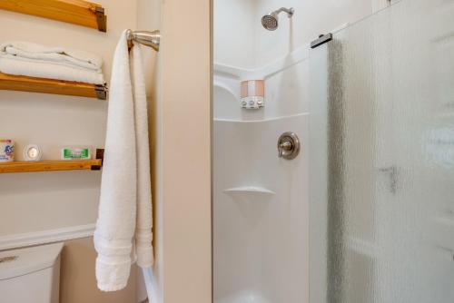 a shower with a glass door in a bathroom at 2 Mi to Steamtown NHS Family Home with Backyard! in Scranton