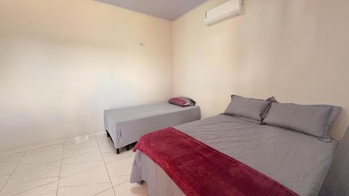 Postel nebo postele na pokoji v ubytování Sossego de Amaro