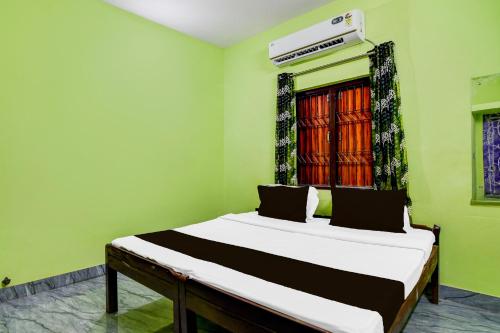 Ένα ή περισσότερα κρεβάτια σε δωμάτιο στο Hotel O Sai Homes