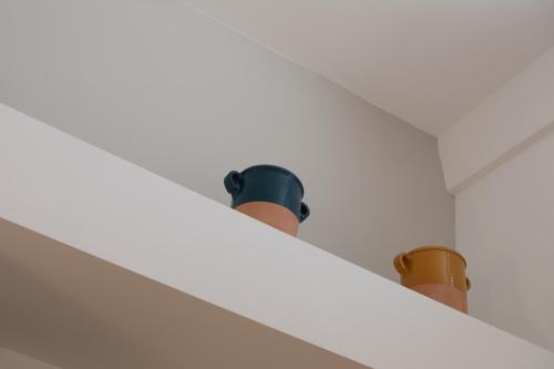 two lights on top of a white ceiling at Casa Vacanze Dea in Nardò
