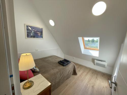Кровать или кровати в номере Le Lodge de Serenite