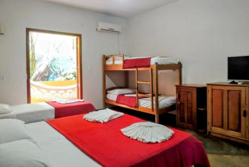 Ένα ή περισσότερα κρεβάτια σε δωμάτιο στο O Pharol Hostel e Pousada