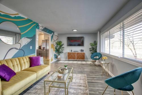 a living room with a couch and a table at Rocksteady Atlanta Decatur in Decatur