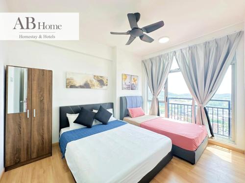 a bedroom with two beds and a ceiling fan at ABHome "FRIDAY Suite" #Midas Seri Alam #City view #Mall #Masai JB in Masai