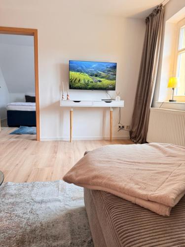 Телевизор и/или развлекательный центр в Ferienwohnung Express
