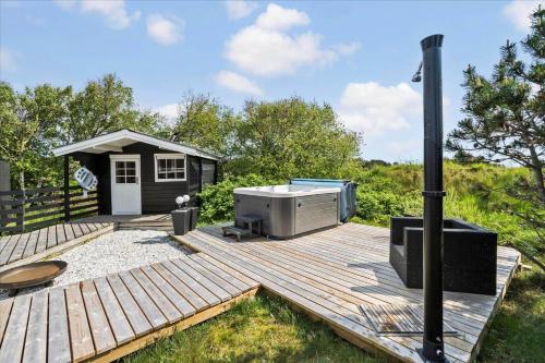 a wooden deck with a heater on top of it at 081-Ringkobing-P-Snejkers-Vej-13 in Ringkøbing