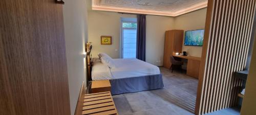 Ένα ή περισσότερα κρεβάτια σε δωμάτιο στο B&B Villa Dina